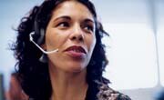 Woman in help center talking on head set