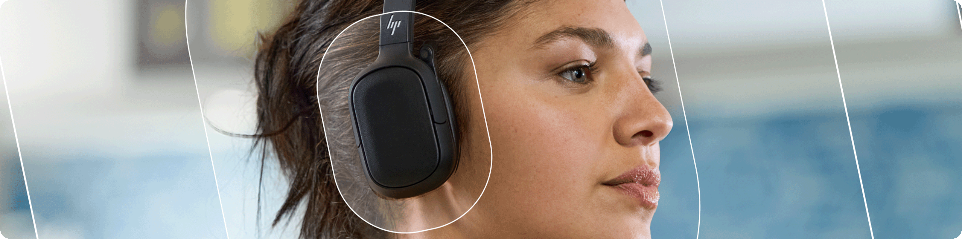 A woman wearing HP Poly Focus headphones designed for uninterrupted listening with long battery life.