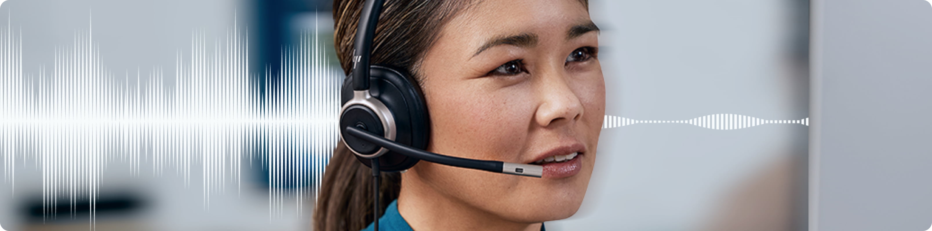 A woman in a conference call using HP Poly Focus headphones with advanced noise-cancelling features for clear conversations.