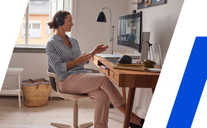 Person working remotely wearing a headset on a video conference call
