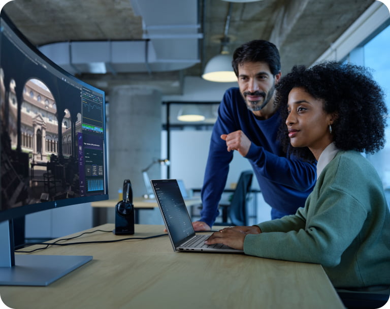 Male and female professional collaborating in a modern workspace with a HP ZBook 8 G1ah 14 inch Mobile Workstation PC