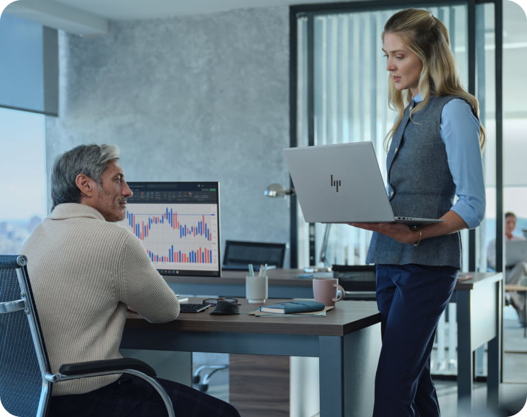 Woman using a laptop in a modern office, representing the future of work and digital transformation