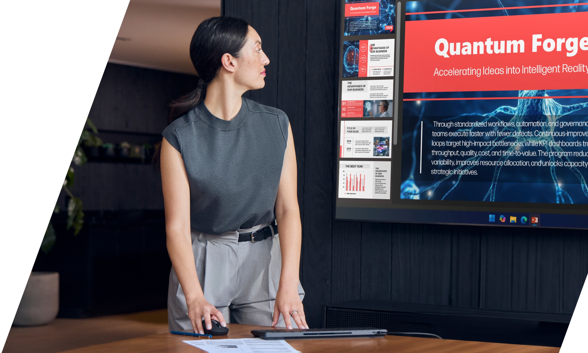 Person holding a mouse and navigating a large display mounted on a wall.