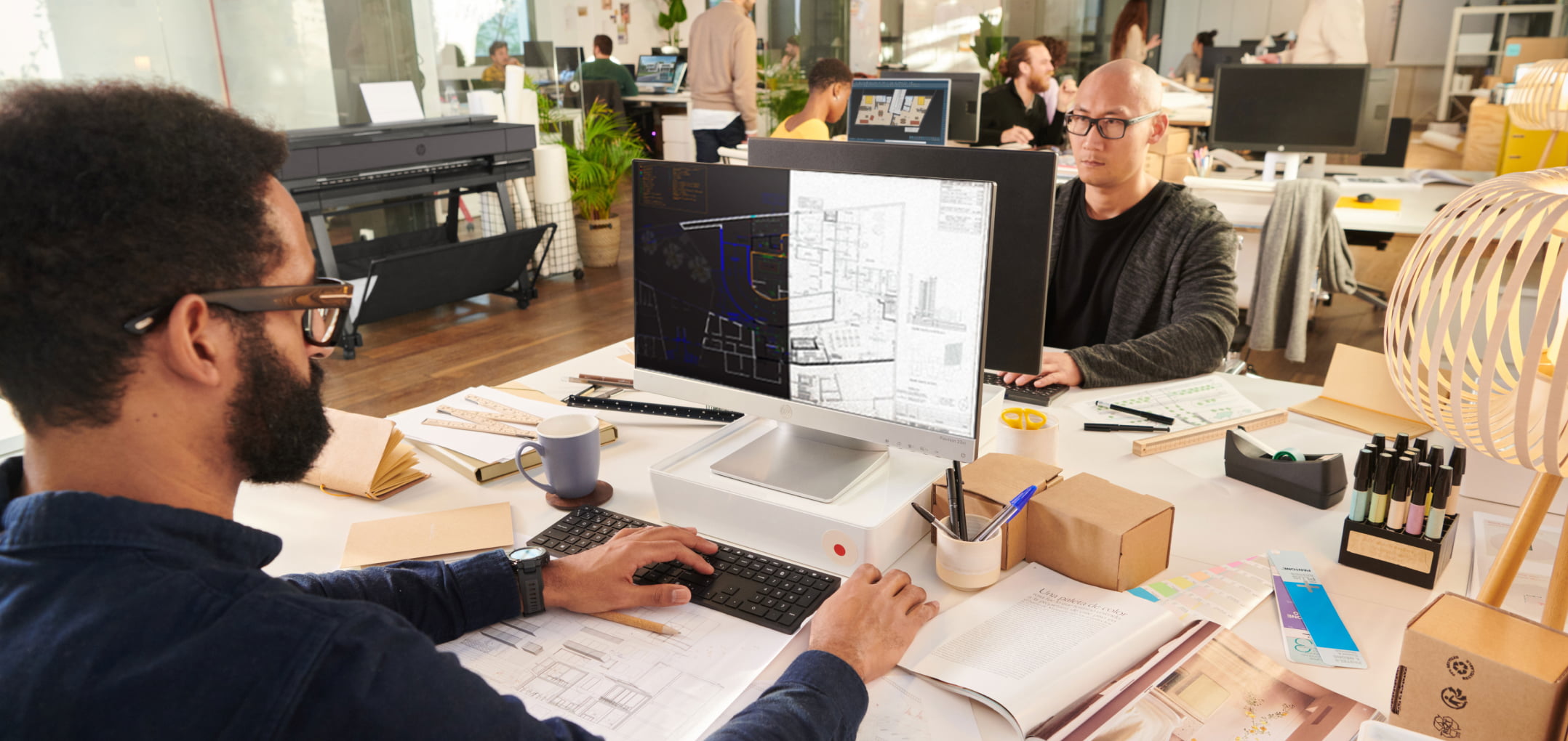 Workers in office using HP Build Workspace tool