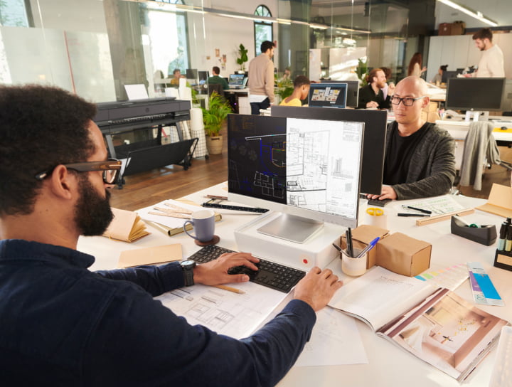 Workers in office using HP Build Workspace tool