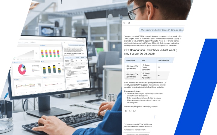차트와 그래프가 표시된 데스크탑 컴퓨터에서 작업하는 사람과 그 뒤에서 협업 중인 두 명의 동료.