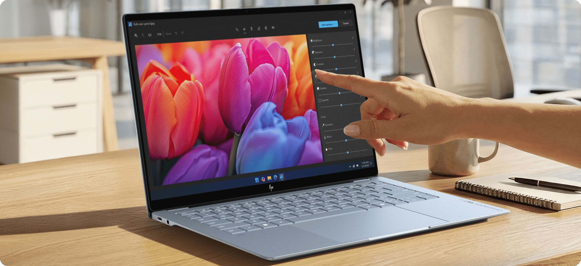 HP OmniBook laptop on a desk, showing a vivid display and intuitive on‑screen controls for focused, modern work.