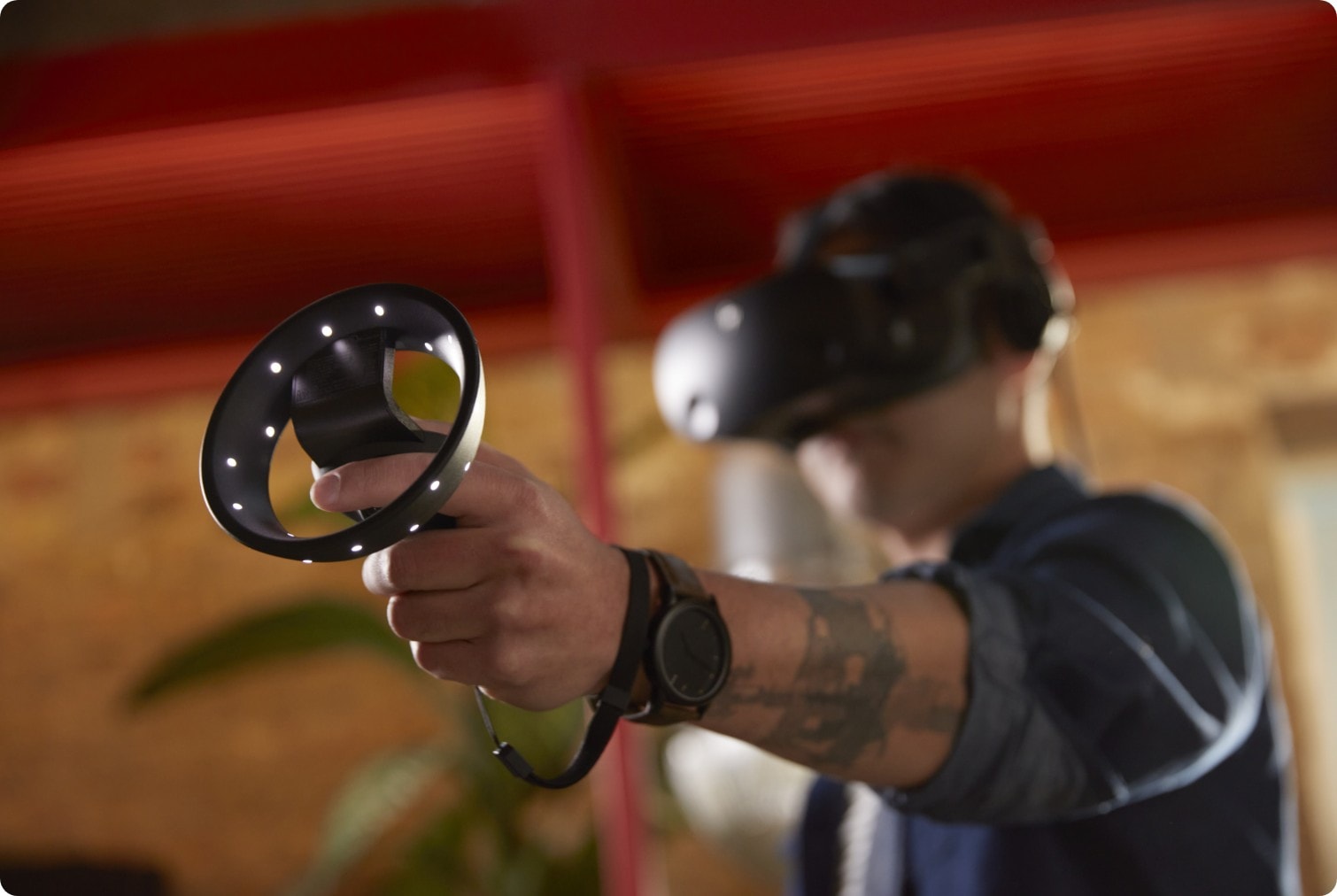 Man using the HP Reverb G2 Virtual Reality Headset and controls