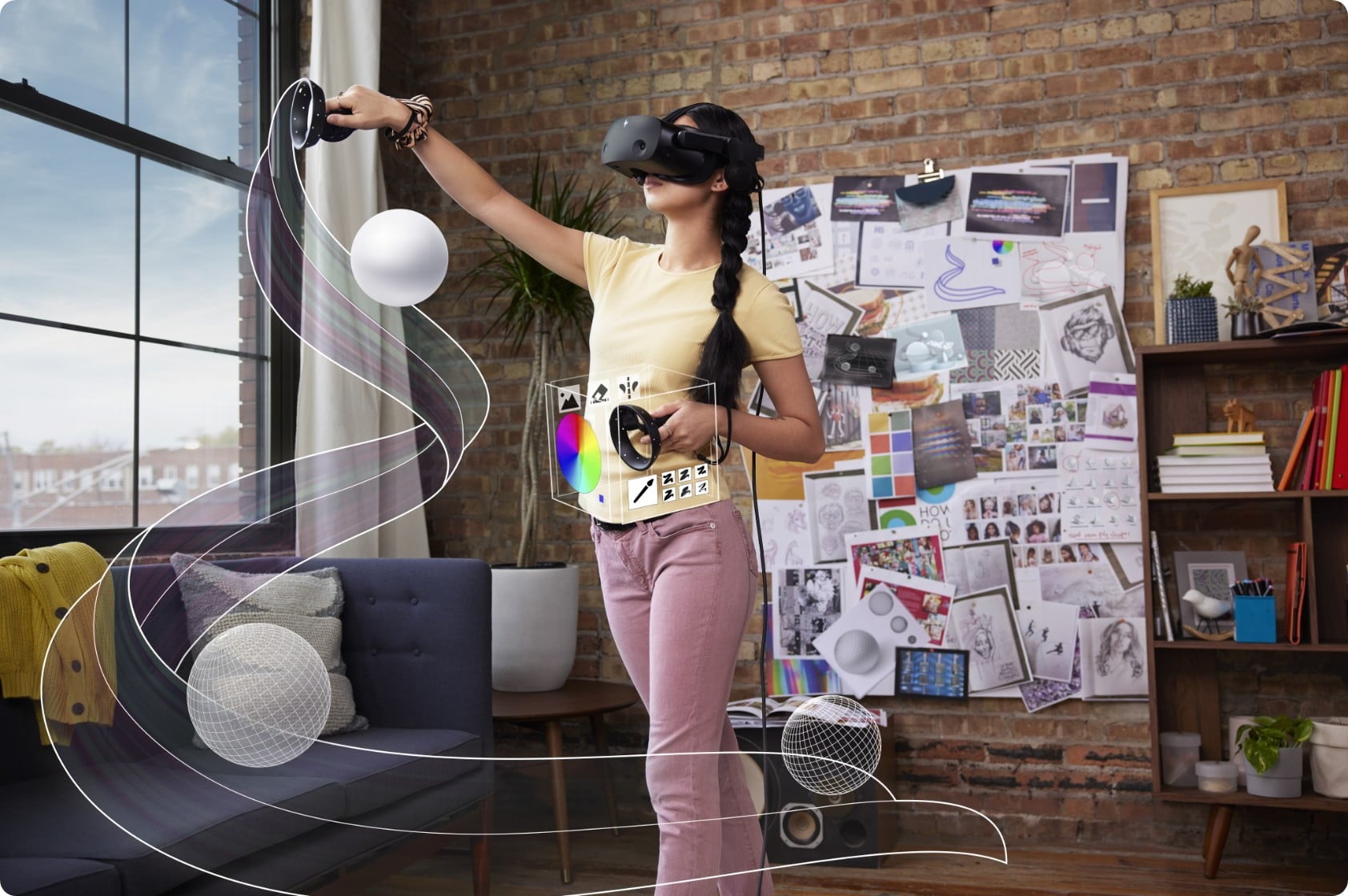 Young woman using the HP Reverb G2 Virtual Reality Headset and controls doing some abstract art