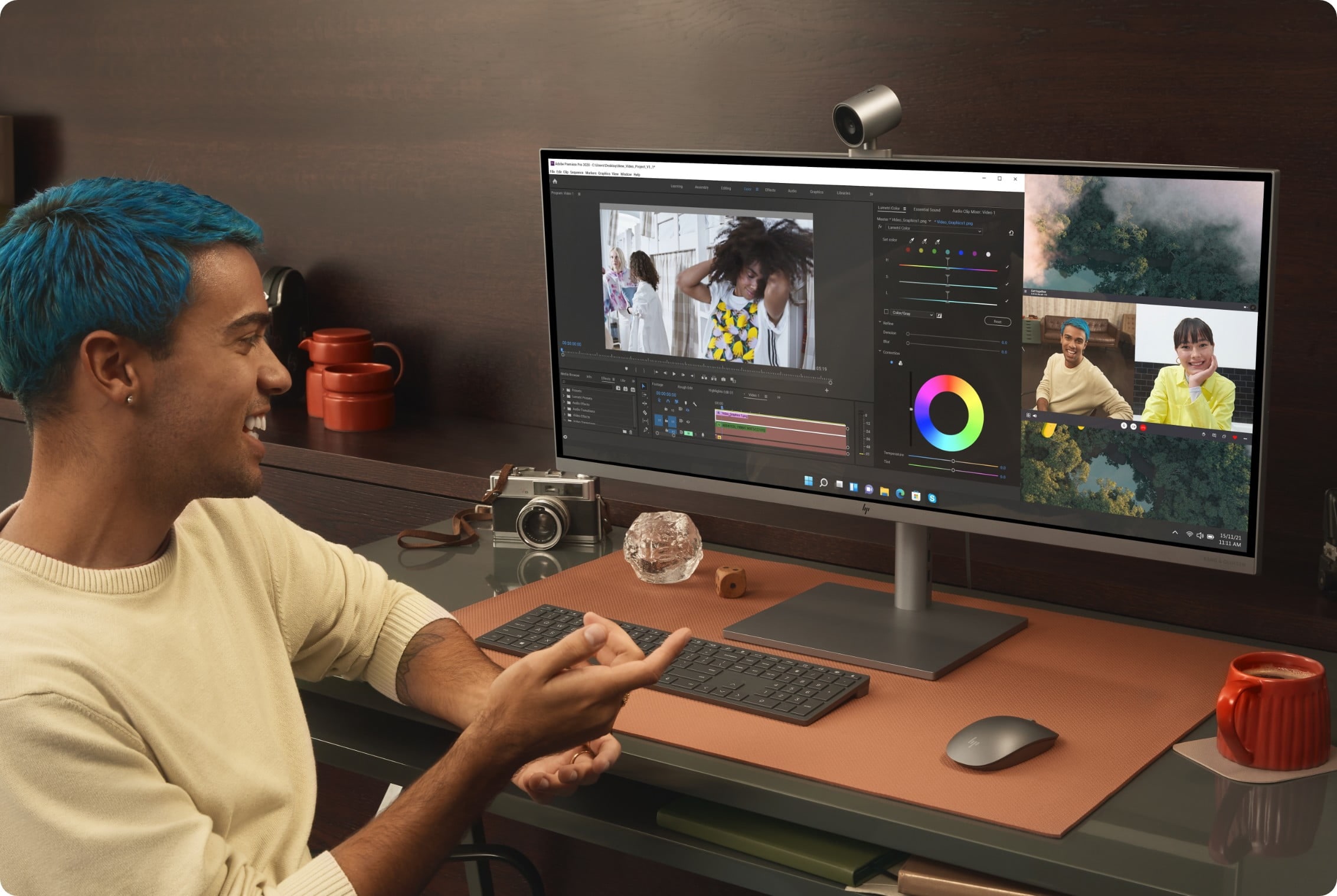 A man working and having a video call on an HP ENVY 34-inch All-in-One Desktop