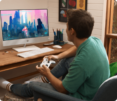 Man playing game online on HP Pavilion All-in-One Desktop