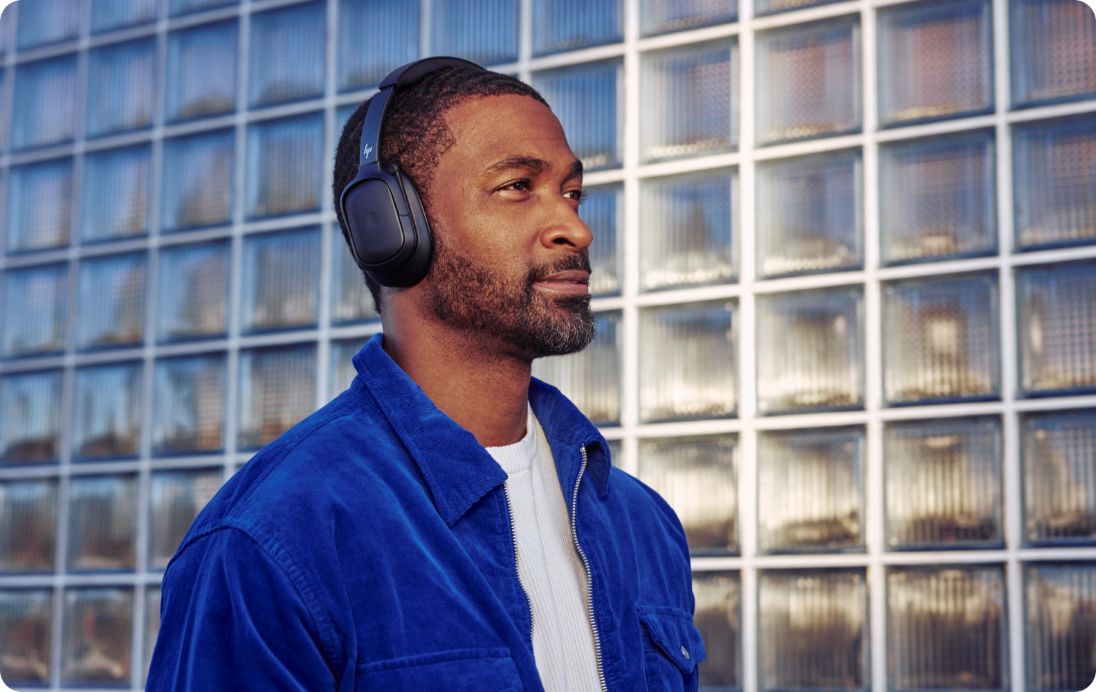 Man wearing HP Poly Focus 6 Series headset