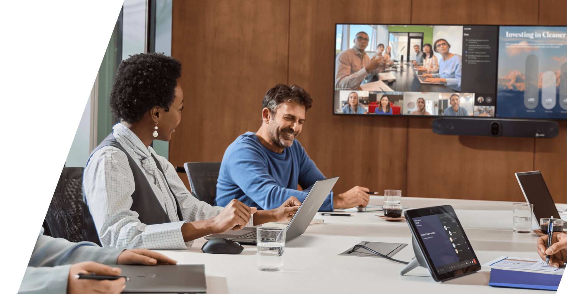 People collaborating in a conference room with HP Poly video conferencing equipment