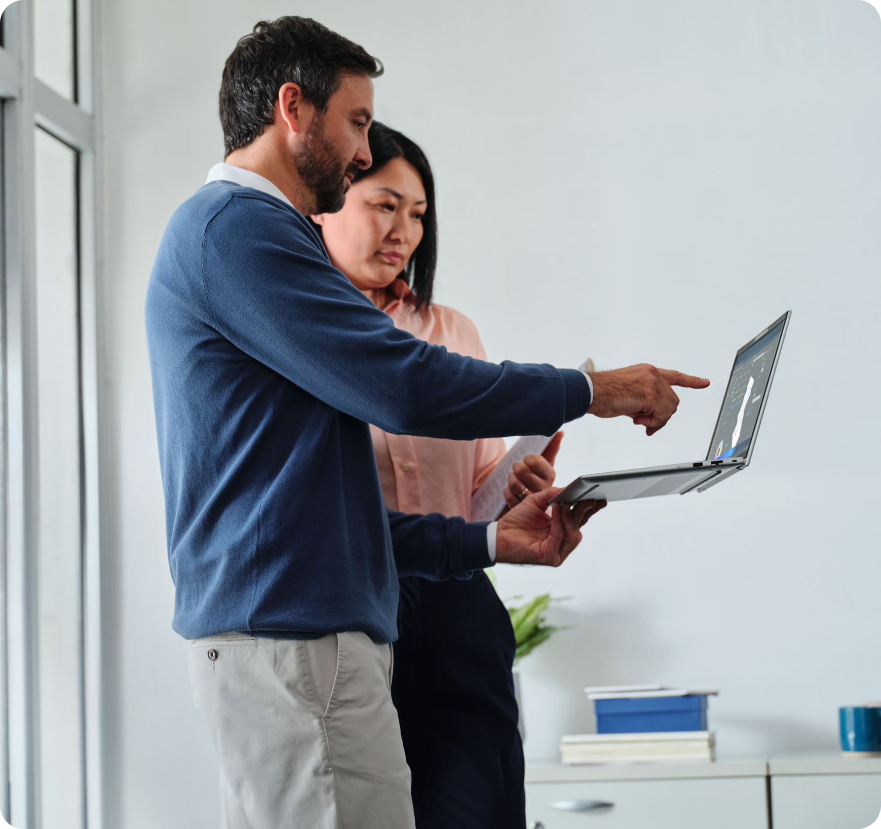 Young woman smiling while having a video call with family members using an HP laptop