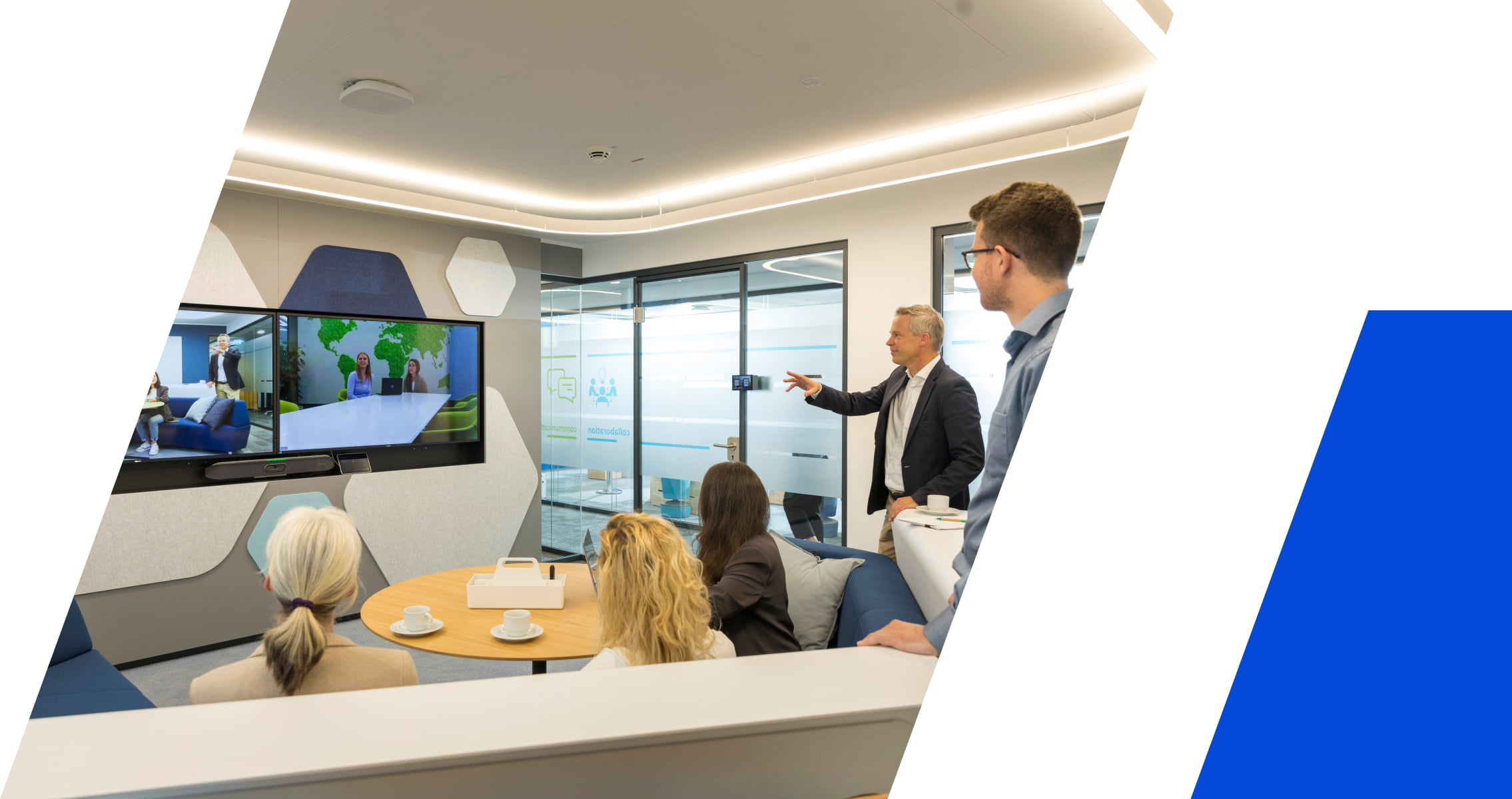 Team of Hannover Re professionals in a modern conference room using HP collaboration technology for a video conference call