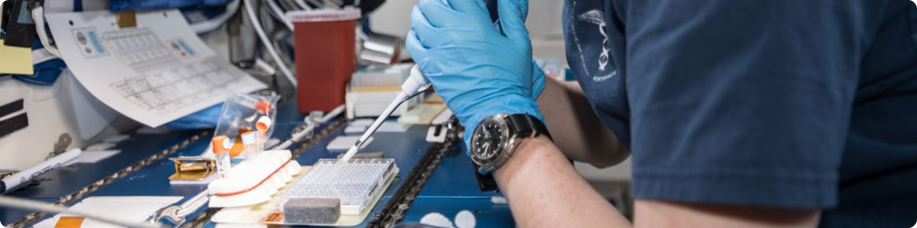 NASA astronaut working on a science experiment on the international space station