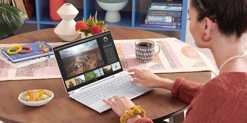 A woman editing video with hp laptop